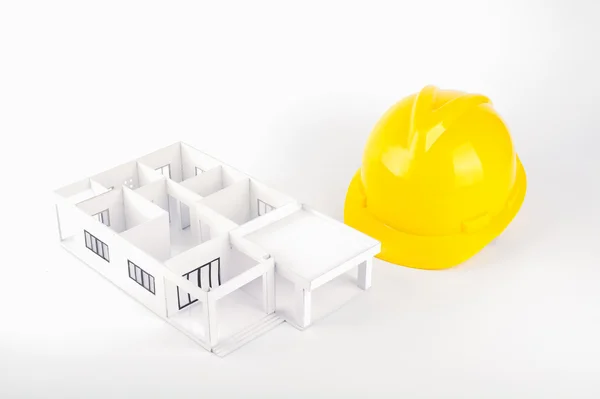 Model of the house and Construction Helmet — Stock Photo, Image