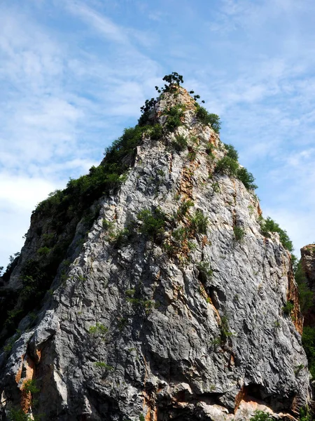 Closeup Big Limestone Rock Cliff Cloudy Blue Sky — ストック写真