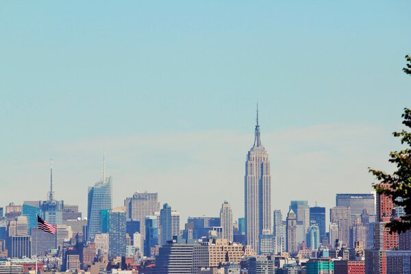 Manhattan skyline with american flag