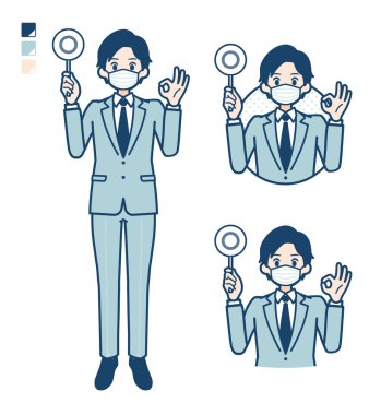 Maske takan genç bir işadamı daire şeklinde bir resim çizdi.