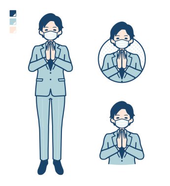 Genç bir işadamı, dua resimlerinde basın mensuplarıyla maske takıyor.