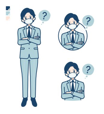 Soru resimleriyle maske takan genç bir işadamı.