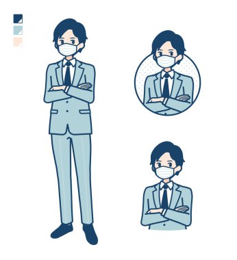 Rahat poz veren maske takan genç bir işadamı.