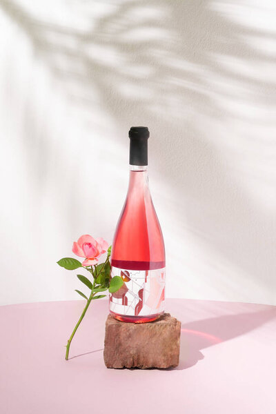 Rose Wine Bottle Red Stone One Pink Rose White Wall Royalty Free Stock Photos