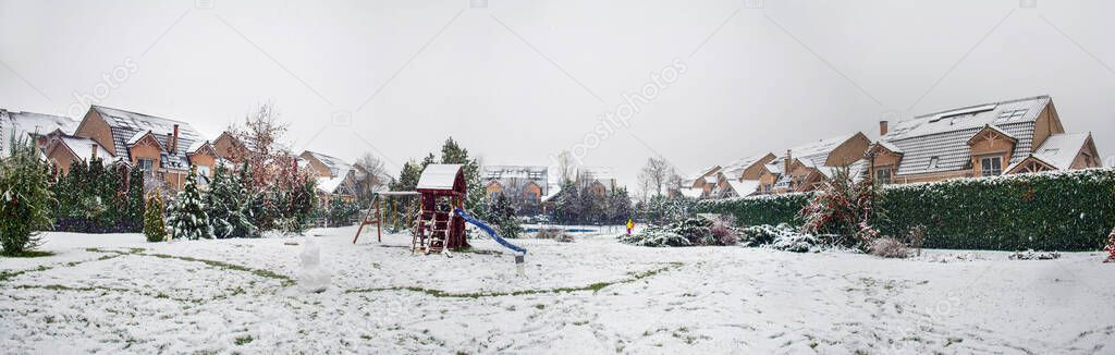 Snow covered yard in a beautiful neigborhood in Bucharest.Christmas landscape