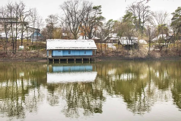 A day after the snow the greatest day to visit Herastrau park. Beautiful landscape with reflections.Moody sky cold day