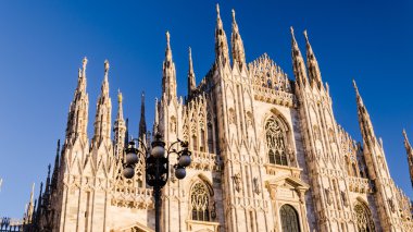view of milan cathedral at sunset clipart