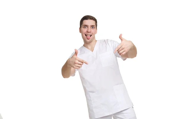 Young Medical Professional Overalls Fooling Shows Tongue Points Fingers Isolated — Stock Photo, Image