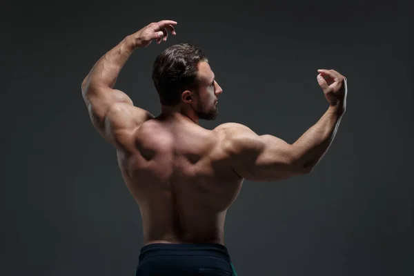 Portrait Young Athletic Man Naked Torso Showing Muscles Isolated Dark — Stock Photo, Image