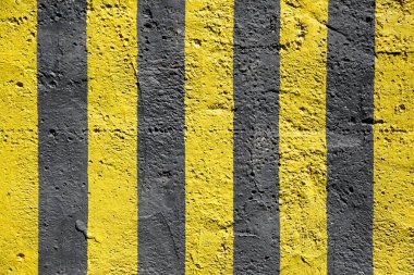 Texture wallpaper, painted in yellow and black stripes untreated concrete surface.