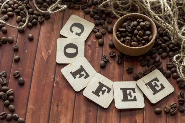 Coffee beans and letters — Stock Photo, Image