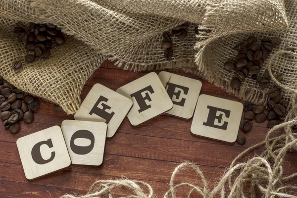 Coffee beans and letters — Stock Photo, Image