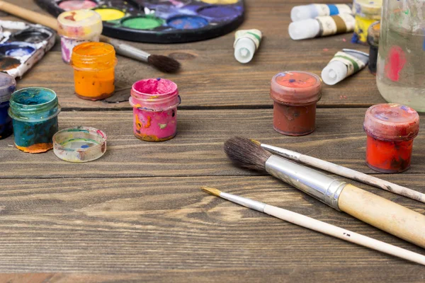 Paint, brushes, palette — Stock Photo, Image