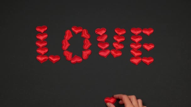 Composing Word Love Small Bright Hearts Dark Background Celebration Valentine — стоковое видео
