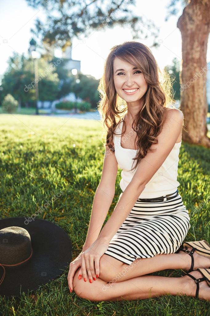 brunette in hat with large fields