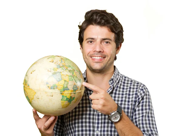 Joven aislado mostrando un globo — Foto de Stock