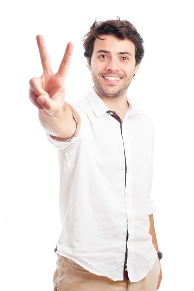 Young man showing victory symbol — Stock Photo, Image