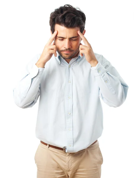 Man concentrating with fingers on temple on a white background — Stockfoto