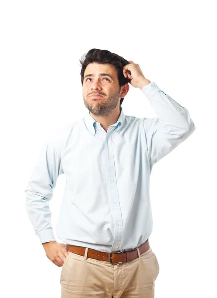young man scratching head on a white background