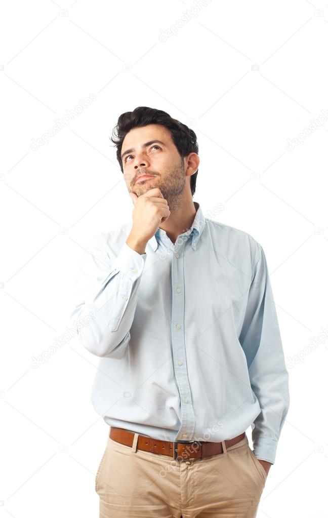 young man thinking on a white background