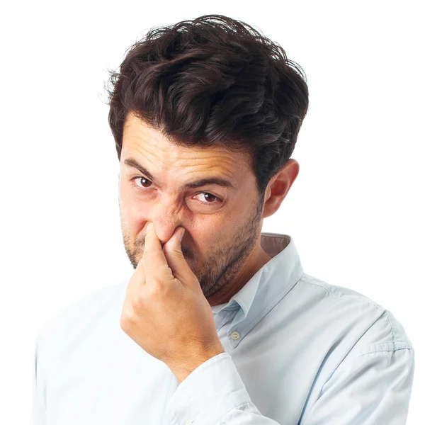 Man with stink gesture on a white background — Zdjęcie stockowe