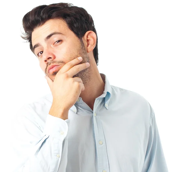 Jovem homem bonito com a mão no queixo imaginar gesto em um branco — Fotografia de Stock