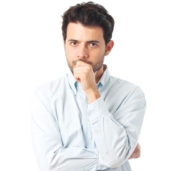 Joven serio sobre un fondo blanco — Foto de Stock