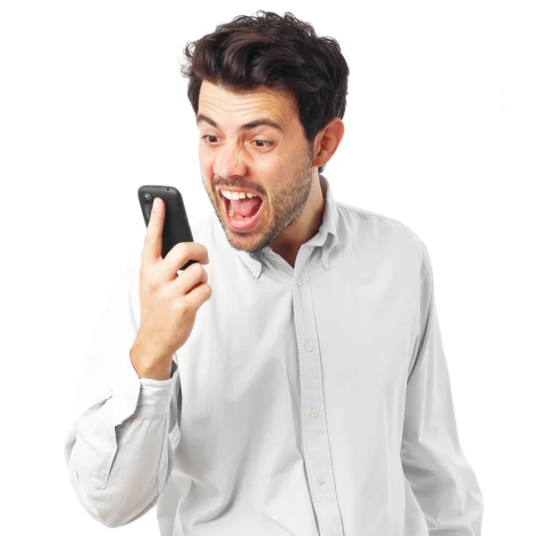 young man shoutting to phone on a white background