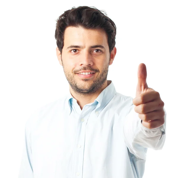 Glücklicher junger Mann hält Schild auf weißem Hintergrund hoch — Stockfoto