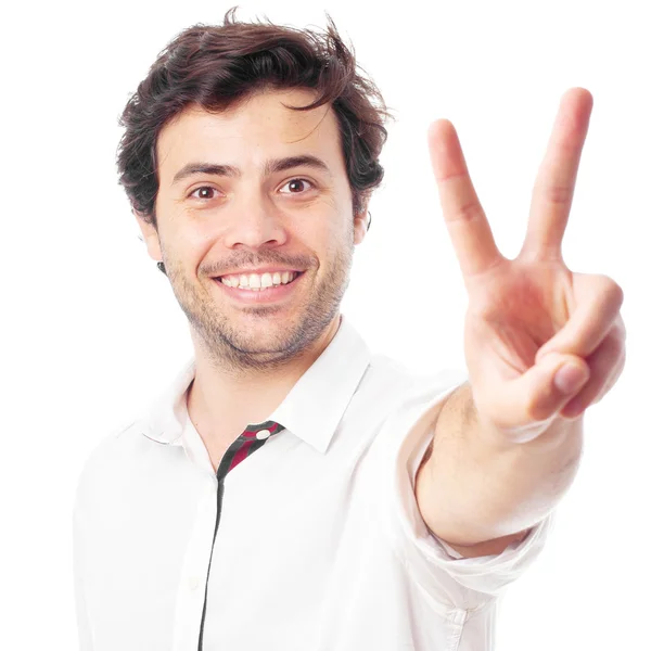 Hombre haciendo símbolo de victoria sobre un fondo blanco —  Fotos de Stock