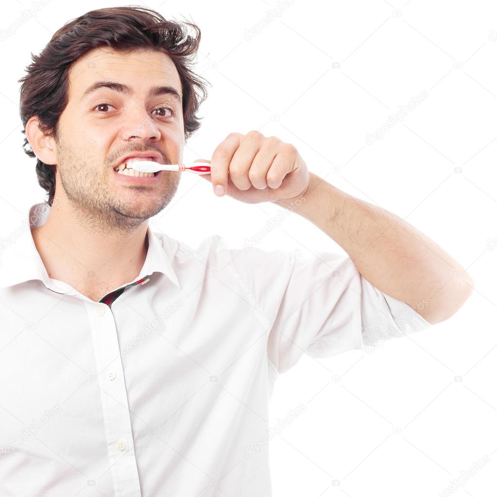 young man brushing teeth