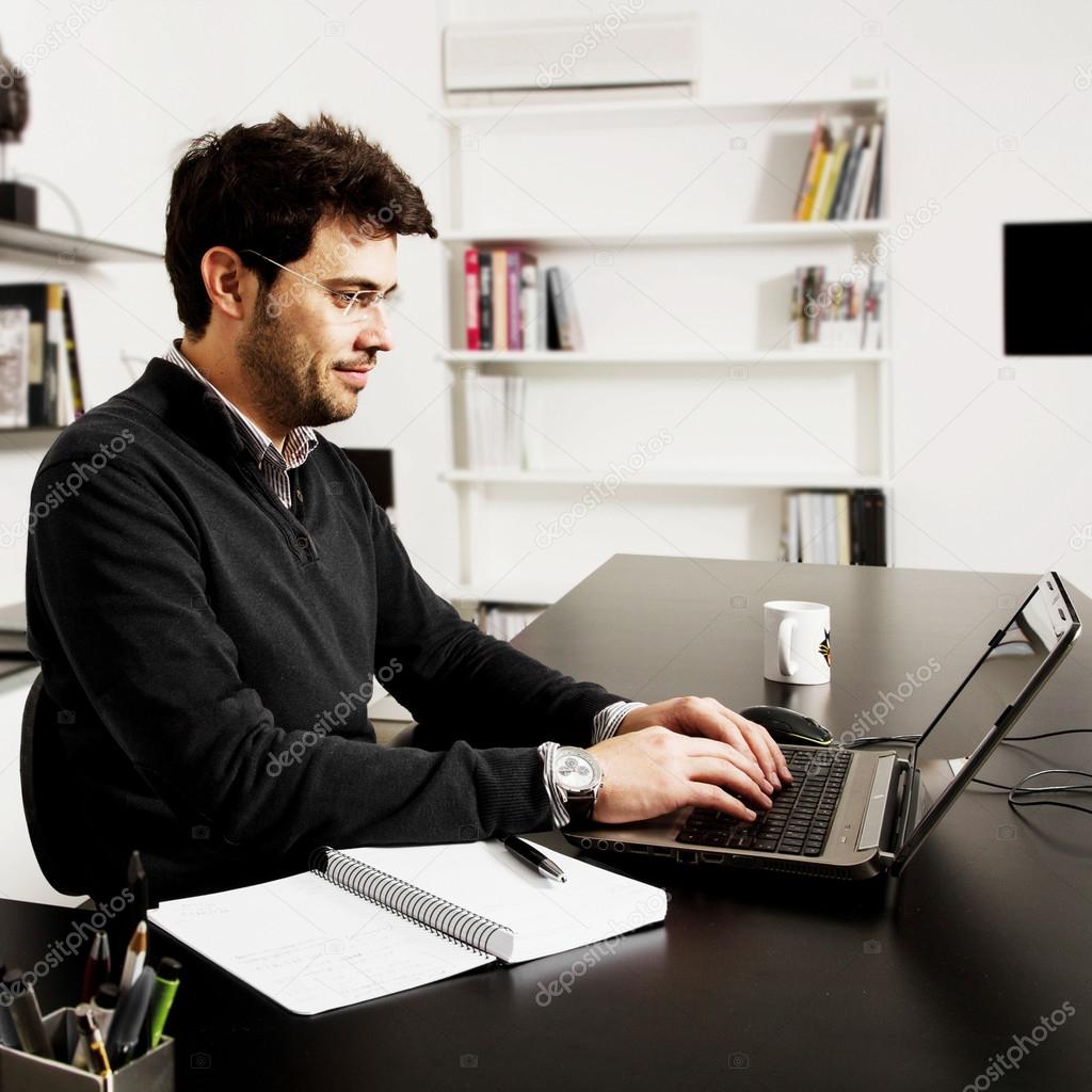 young man start up over bookshelf background