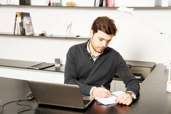 Young man start up working on desk — Stok fotoğraf