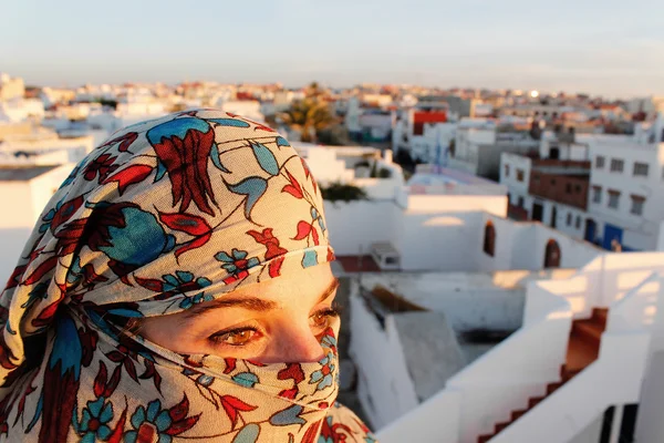 young arab woman in hijab with sexy eyes. Rooftop terrace view