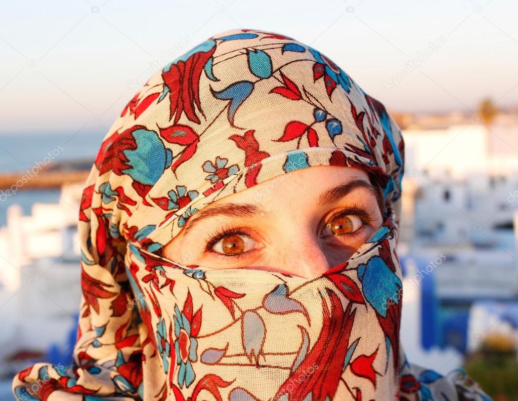 young arab woman in hijab with sexy eyes. Rooftop terrace view