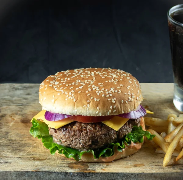 Hamburger meal served with french fries and soda. Fast food