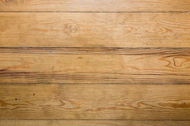 Yukarıdan görünen eski ahşap zeminin arka planı. Vernikli ahşap şeritler. 