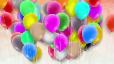 Bir sürü renkli balon rüzgarın gücüyle sallanıyor.