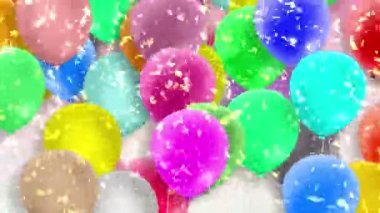 Bir sürü renkli balon rüzgarın gücüyle sallanıyor.