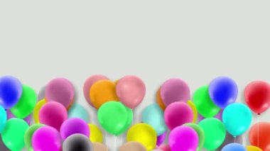 Bir sürü renkli balon rüzgarın gücüyle sallanıyor.