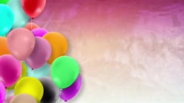 Bir sürü renkli balon rüzgarın gücüyle sallanıyor.