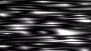 Kıvrımlı dalgalı yüzey sürekli ışığa yansıyor..