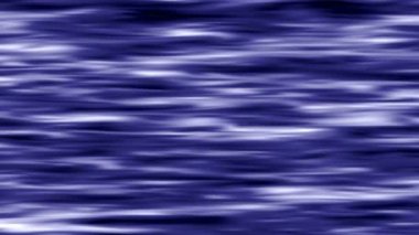 Kıvrımlı dalgalı yüzey sürekli ışığa yansıyor..