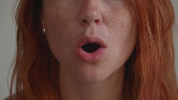 Attractive young girl with red hair. Shows different emotions — Stock Video