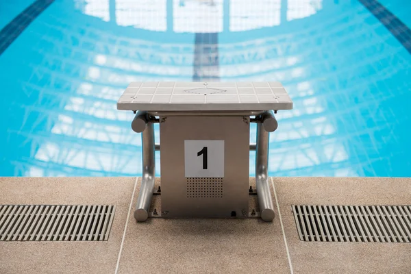 Swimming pool starting block No.1 — Stock Photo, Image