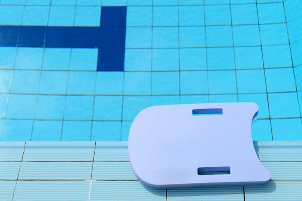 Blue foam board in a pool — Stock Photo, Image