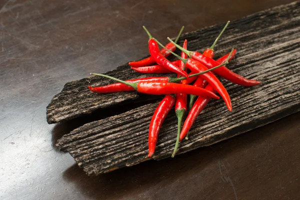 Red chillies on a plank