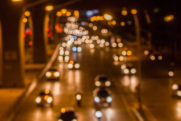 Cars running on the streets at night shooting blur.