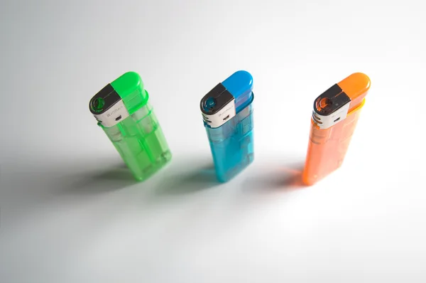 Colored lighters, top view, standing, isolated — Stock Photo, Image