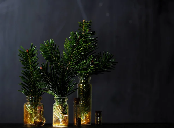 Spruce branches in glass jars with gold glitter — Stock Image Spruce Branches Glass Jars Gold Glitter Royalty Free Stock Images